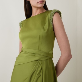 Model wearing Maisonel Beaded Drape Dress in Meadow green, showing beaded cap sleeve embellishment and draped waist detail.