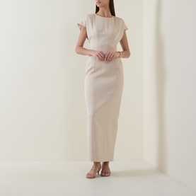 Model wearing Maisonel Floral Embellished Pencil Dress in Latte, midi length, short sleeves, round neckline, styled with tan heeled mules.