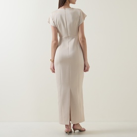 Model wearing Maisonel Floral Embellished Pencil Dress in Latte, showing rear view with back vent, short sleeves and midi length.