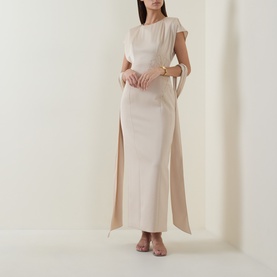 Model wearing Maisonel Floral Embellished Pencil Dress in Latte, midi length, short sleeves, fluid fabric with side slit detail, styled with nude