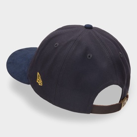 New Era navy cotton cap, rear view showing gold logo flag, suede-effect brim and brown leather adjustable strap