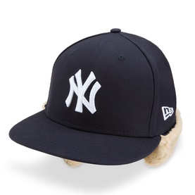 New Era navy NY Yankees 59FIFTY cap with cream faux fur ear flaps and white embroidered logo, flat peak