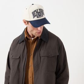 Model with New Era NY Yankees 9FORTY A-Frame Snapback Cap in light stone and navy, embroidered wordmark, faux suede visor