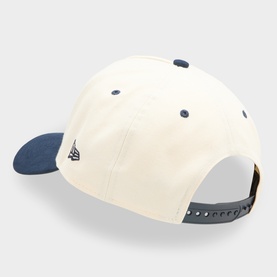 New Era navy and cream cotton baseball cap, rear view showing adjustable snap-back fastening and New Era flag logo