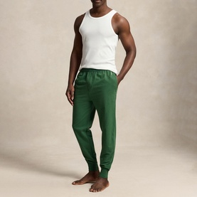 Model wearing Ralph Lauren Verano Green jogger lounge bottoms with elasticated waist and cuffs, styled with a white vest top