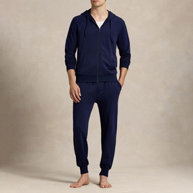 Model wearing Ralph Lauren cruise navy joggers styled with matching navy zip-through hoodie and white T-shirt