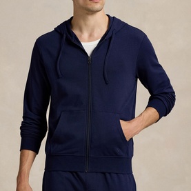 Model wearing Ralph Lauren cruise navy zip-through hoodie with drawstring hood, styled with matching navy joggers and white T-shirt.