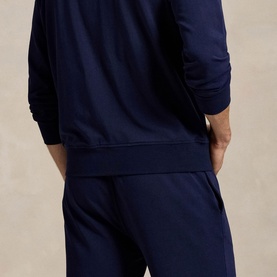 Model wearing Ralph Lauren cruise navy lounge bottoms with matching navy zip-through top, rear view showing relaxed fit.
