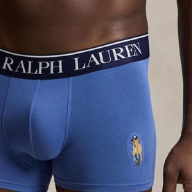 Model wearing Ralph Lauren blue cotton boxer briefs with branded navy waistband and embroidered Polo Bear logo on hip