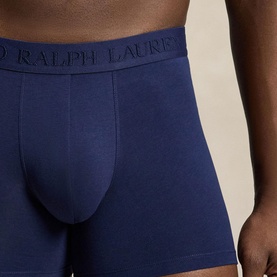 Model wearing Polo Ralph Lauren navy blue boxer briefs with branded elastic waistband, close-up detail view