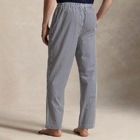Model wearing Ralph Lauren Signature Pony Stripe Pyjama Bottoms in navy and white stripe, shown from behind, with elasticated waistband.