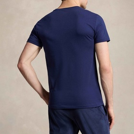 Model wearing Ralph Lauren Polo Player Navy T-Shirt Three-Pack, back view, short sleeves, paired with navy trousers