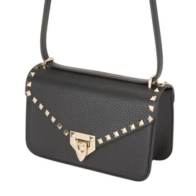 Valentino Rockstud shoulder bag in nero black pebbled leather with gold stud trim, flap closure, and adjustable crossbody strap