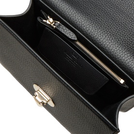 Valentino Nero black leather shoulder bag interior view showing zip compartment and gold-tone twist-lock clasp detail