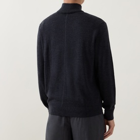 Model wearing Calvin Klein Monogram Logo Half-Zip Sweater in Gunmetal Heather, rear view showing half-zip placket and ribbed trims, styled with grey