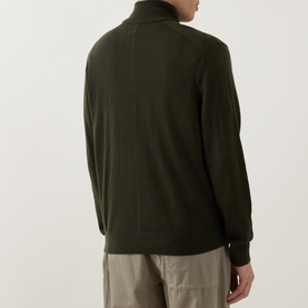 Model wearing Calvin Klein Monogram Logo Half-Zip Sweater in Olive Night, back view, styled with stone chino trousers.