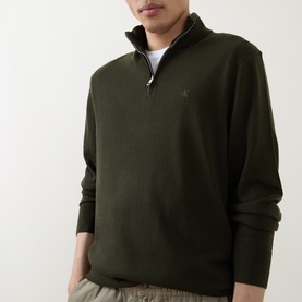 Model wearing Calvin Klein Monogram Logo Half-Zip Sweater in Olive Night, featuring funnel neck, half-zip placket and tonal chest logo