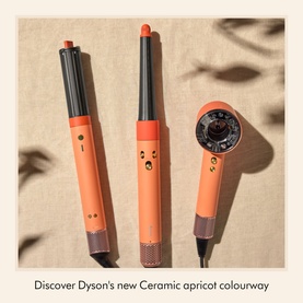 Dyson Ceramic Apricot hair styling tools set including hair dryer, curler and styler in coral-orange colourway