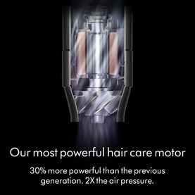 Dyson Coanda 2x Ceramic Apricot hair tool motor close-up, copper-toned components visible with text highlighting most powerful hair care motor.