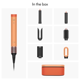 Dyson Coanda 2x Ceramic Apricot hair styler in-the-box contents showing main device and six attachments in apricot and dark grey