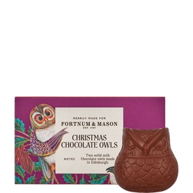 Fortnum & Mason Christmas Chocolate Owls, solid milk chocolate owl figure beside festive illustrated packaging