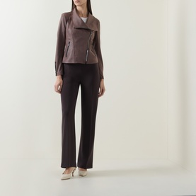 Model wearing Joseph Ribkoff mink asymmetric zip jacket with wide-lapel collar, styled with matching straight-leg trousers and nude heels.