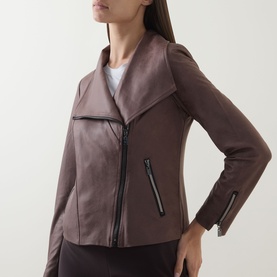 Model wearing Joseph Ribkoff Jacket in Mink, featuring asymmetric zip fastening, draped collar and zip-detail cuffs.