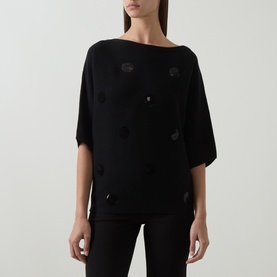 Model wearing Joseph Ribkoff Sequin Embellished Knitted Sweater in black with boat neckline, dropped shoulders, short sleeves and scattered sequin
