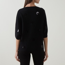 Model wearing Joseph Ribkoff Sequin Embellished Knitted Sweater in black, back view, with scattered sequin detailing and short sleeves.
