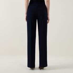 Model wearing Joseph Ribkoff Trousers in Midnight Blue, rear view showing wide-leg silhouette and tailored finish, styled with heels.