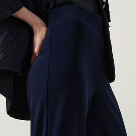 Model wearing Joseph Ribkoff Trousers in midnight blue, close-up of wide-leg silhouette with side pocket detail, styled with black top.