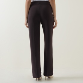 Model wearing Joseph Ribkoff mocha straight-leg trousers, back view, styled with nude heels.