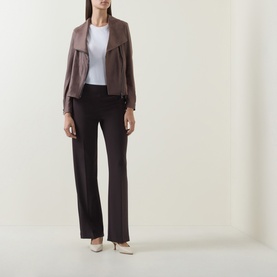 Model wearing Joseph Ribkoff Mocha trousers in flared fit, styled with a taupe jacket and white top, cream heels.