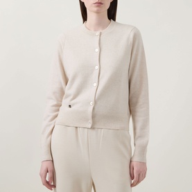 Model wearing Lucy Nagle The Everyday Cardigan in Pearl, fine knit with round neck, pearl buttons and ribbed trims, styled with matching wide-leg