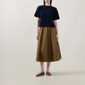 Model wearing Lucy Nagle The Cashmere Top in Midnight Slate, crew neck, short sleeves, styled with tan midi skirt and loafers