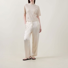 Model wearing Lucy Nagle The Cashmere Top in Pearl, styled with cream wide-leg trousers and black flat sandals.