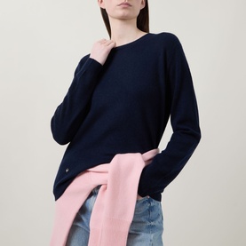 Model wearing Lucy Nagle The Everyday Cashmere Sweater in Midnight Slate, crew neck, long sleeves, styled with a pink scarf tied at waist and jeans.