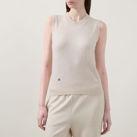 Model wearing Lucy Nagle The Crew Cashmere Top in Pearl, sleeveless fine knit with crew neck and logo disc, styled with cream wide-leg trousers