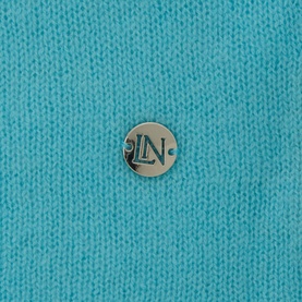 Lucy Nagle The Travel Wrap in Bambino turquoise fine knit cashmere-blend, close-up of silver logo disc detail