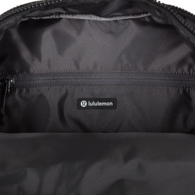 Lululemon Everyday Backpack 21L in Black/Graphite Grey, interior view showing zip pocket and branded lining