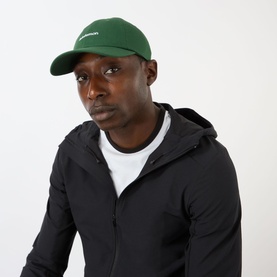 Model with Lululemon Classic Wordmark Ball Cap in Ivy Grove/White, styled with black zip-up hoodie and white tee