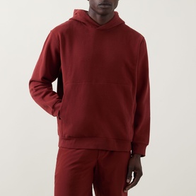 Model wearing Lululemon Cranberry Charm hoodie with matching joggers in coordinated sweatsuit set.
