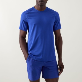 Model wearing Lululemon Beach Ball Blue performance T-shirt, styled with matching blue shorts.