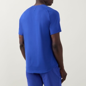 Model wearing Lululemon Beach Ball Blue performance T-shirt, back view, styled with matching blue joggers.
