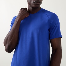 Model wearing Lululemon Beach Ball Blue performance T-shirt, close-up showing crew neck and short raglan sleeves