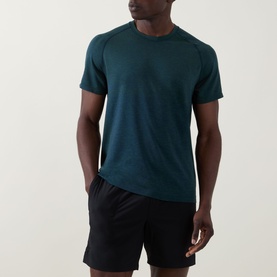 Model wearing Lululemon Metal Vent Tech Short-Sleeve T-Shirt in Green Cove/Club Blue, styled with black shorts