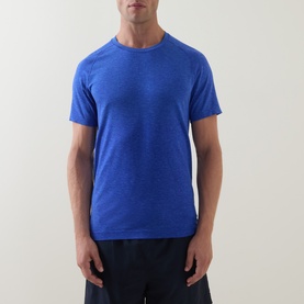 Model wearing Lululemon Metal Vent Tech Short-Sleeve T-Shirt in Ocean Wave/Beach Ball Blue, styled with dark shorts