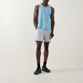 Model wearing Lululemon Seafoam sleeveless performance tank top, styled with grey shorts and black trainers.