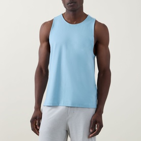 Model wearing Lululemon Seafoam sleeveless performance vest, styled with light grey shorts