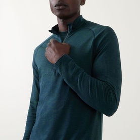 Model wearing Lululemon Metal Vent Short Sleeve T-Shirt in Green Cove/Club Blue, shown as long-sleeve zip-neck style, close-up torso view